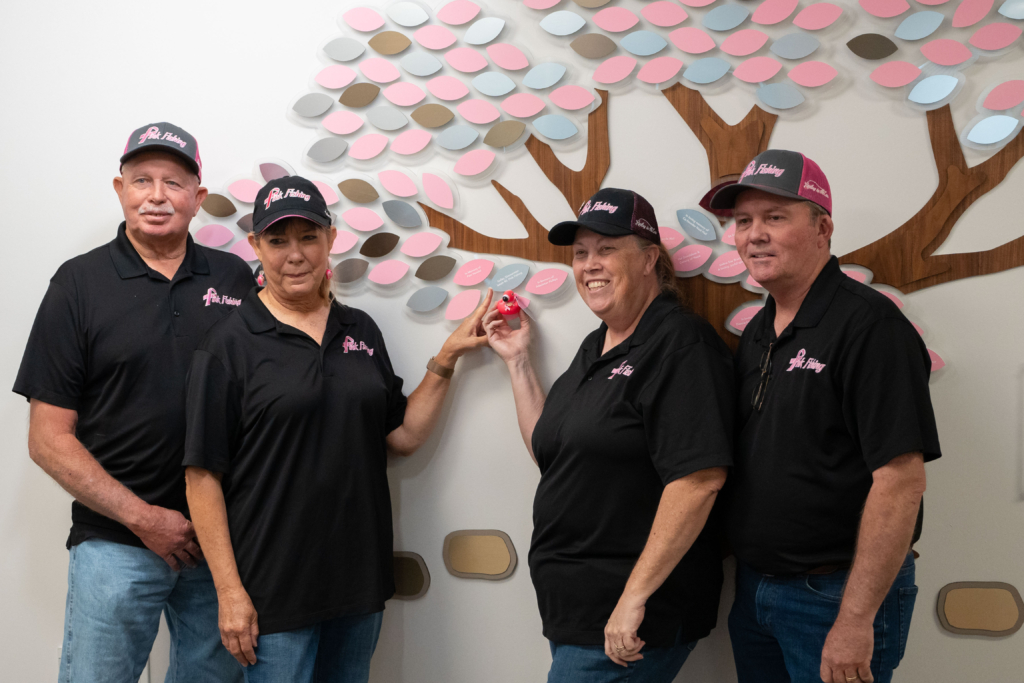 Pink Fishing staff celebrating successful fundraiser for NBCF.